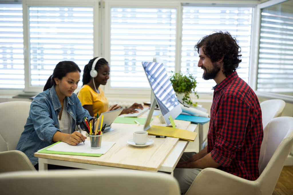 Group of graphic designers working together in office